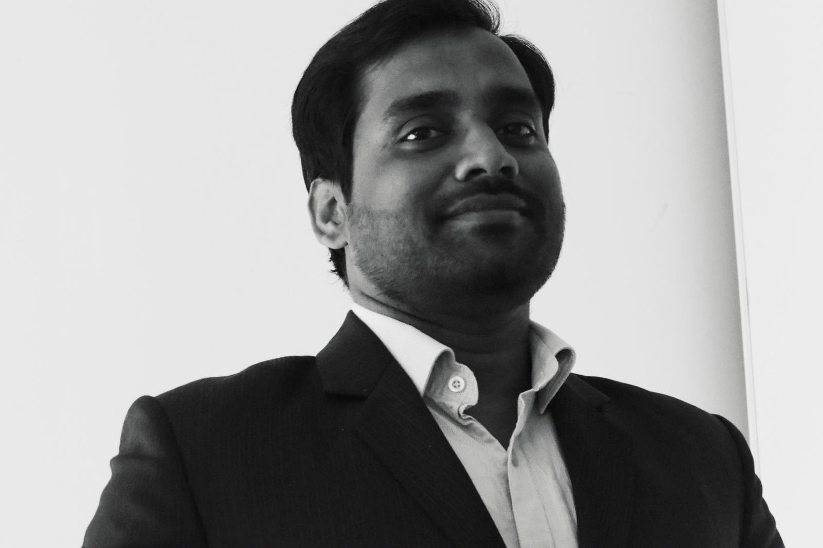 Dr. Anshul Baral standing in a formal attire